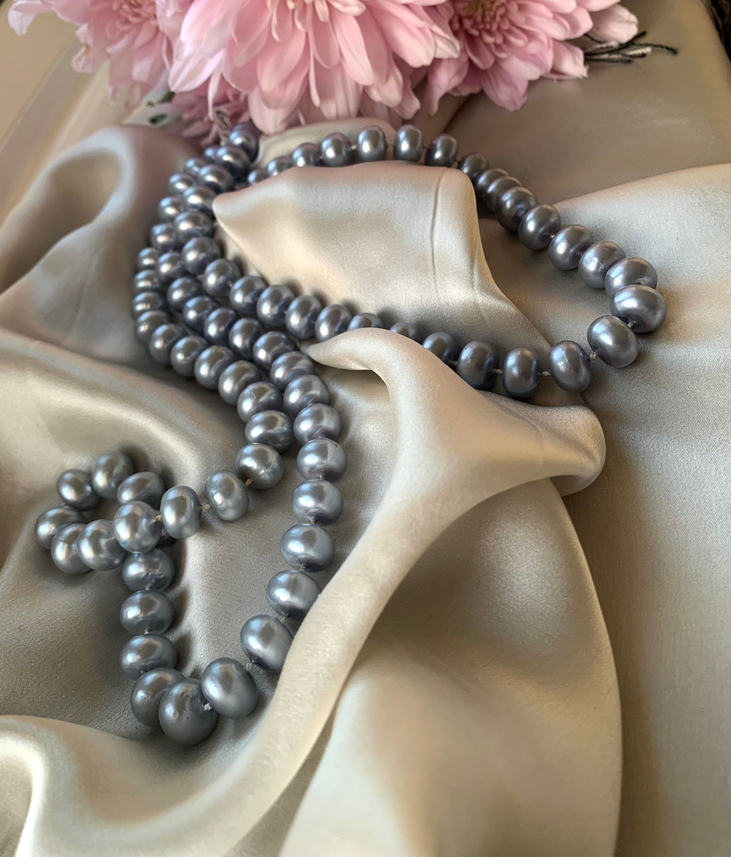 Silver colour plastic rondelle pearl beads sealed on a thread long necklace for a woman or unisex. Lovely vintage gift for her.