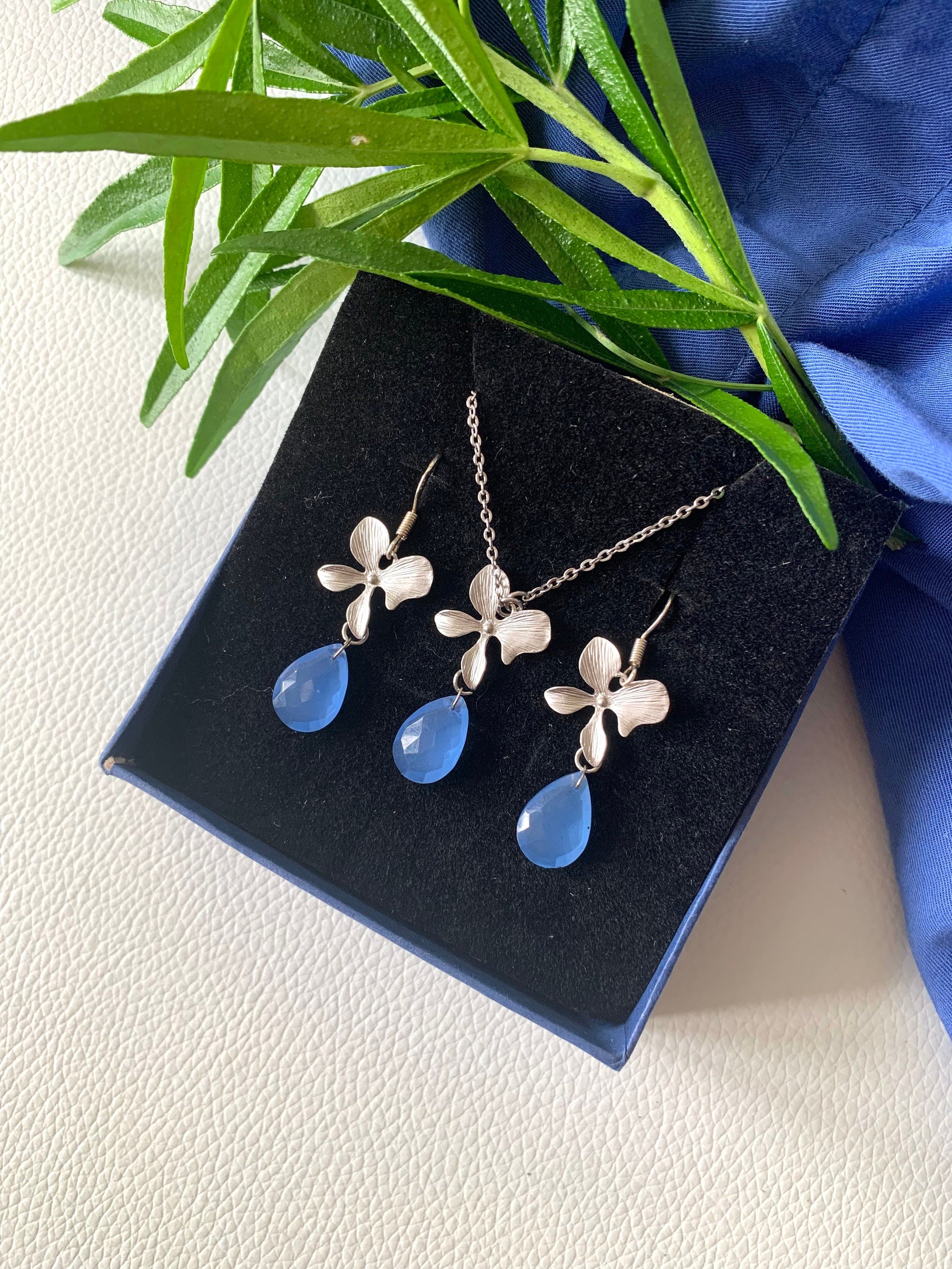 Natural Indian Blue Chalcedony and Silver plated Orchid connector on Stainless Steel Fine Chain Necklace with matching Earrings Set. For Her