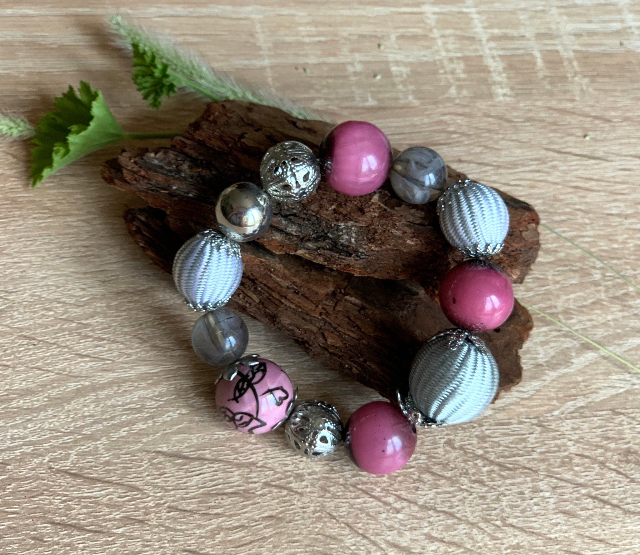 Pink, grey and silver colours various shape, size and materials elasticated vintage bracelet. Boho bracelet for a woman. Gift for her.