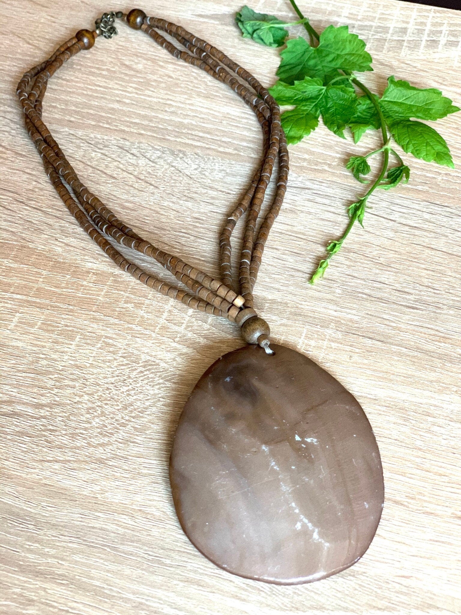 Very large natural shell bronze coloured pendant on a 3 strands wooden heishi beads boho vintage choker necklace for a woman. Gift for her