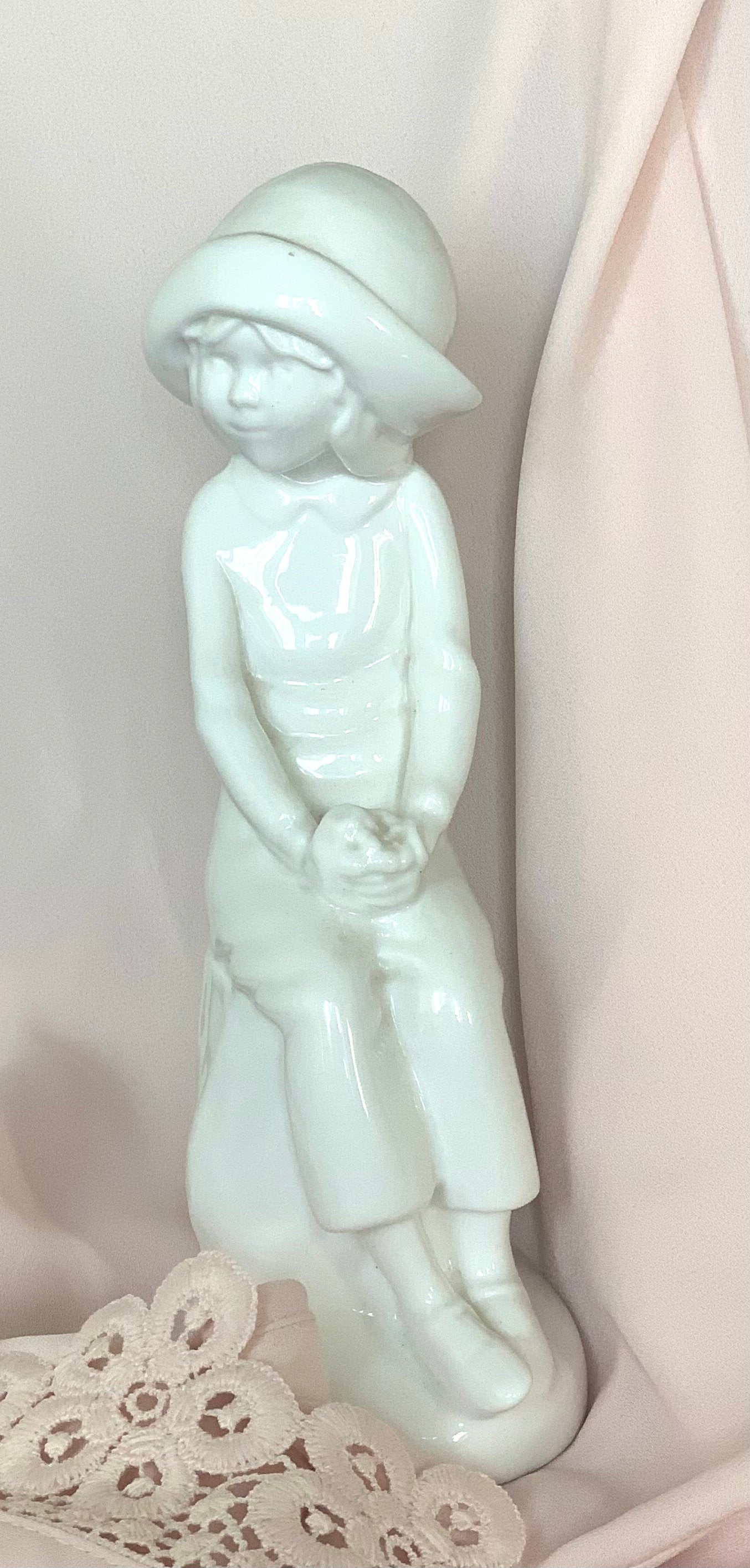 Lovely white porcelain figurine of a girl in boy’s clothes singed Joanne by Pauline Shore. Vintage collectible gift unisex.