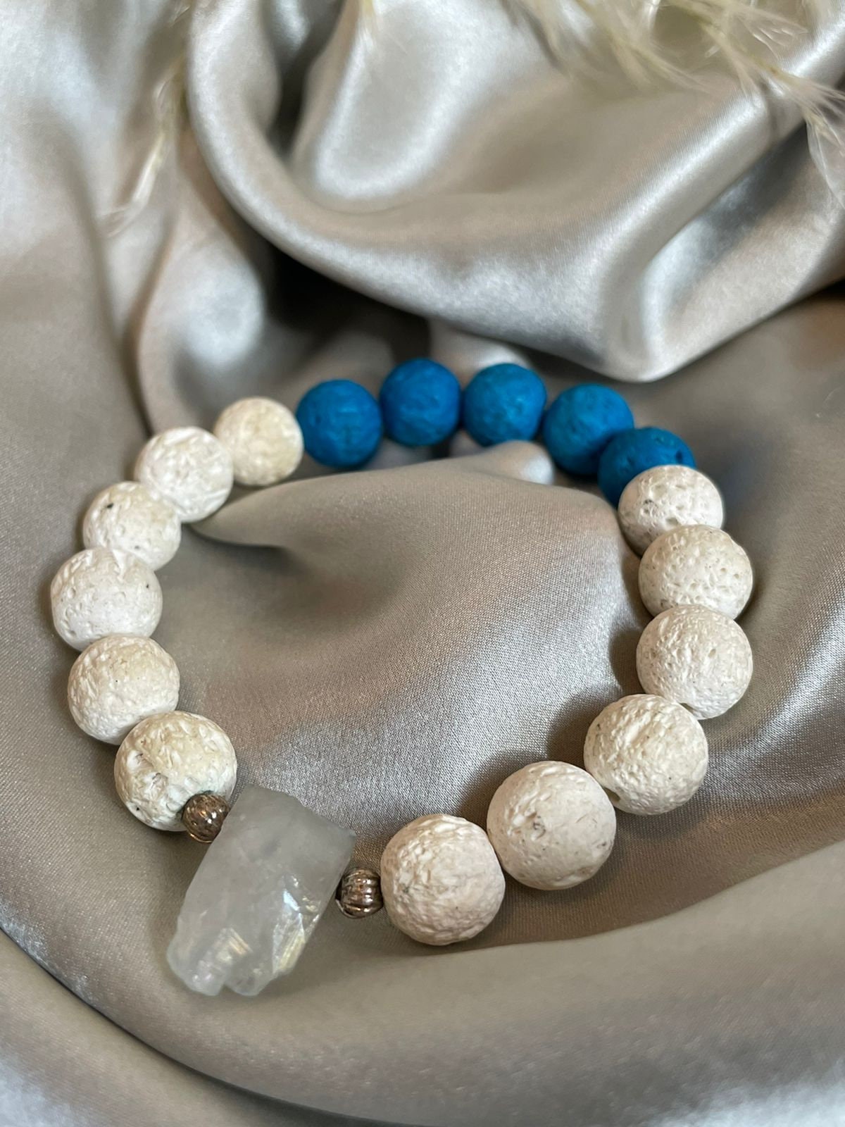 Natural white and blue (coloured) Lave stone beads with Clear Quartz central raw crystal magic bracelet. Meaningful gift for her or unisex