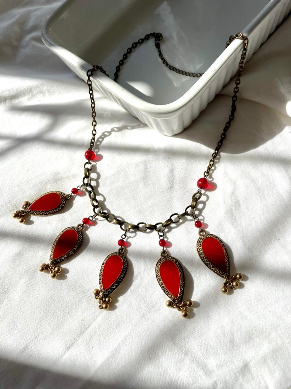 Oriental style brass and bright red enamel charms and red glass beads vintage choker necklace.