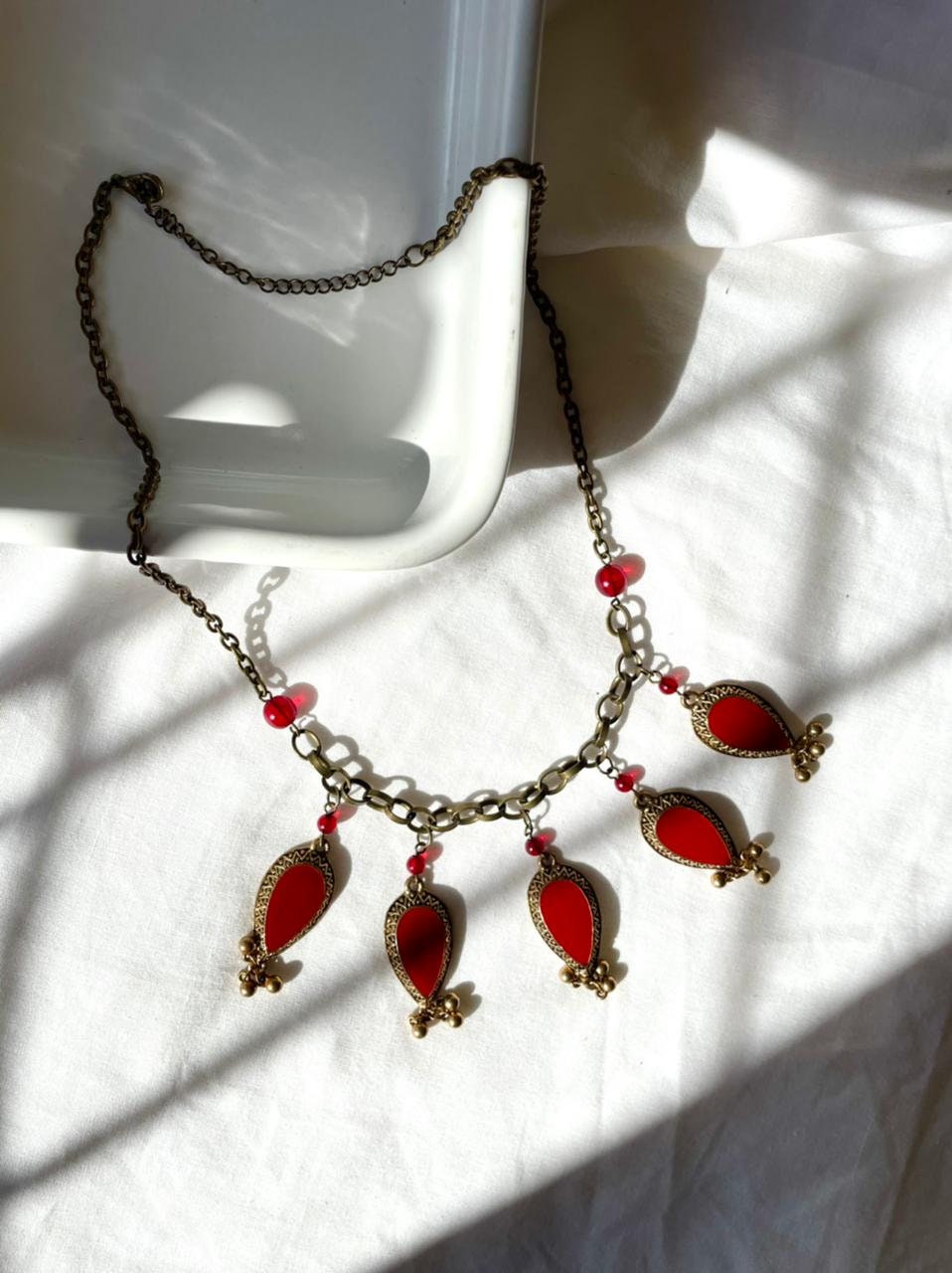 Oriental style brass and bright red enamel charms and red glass beads vintage choker necklace.