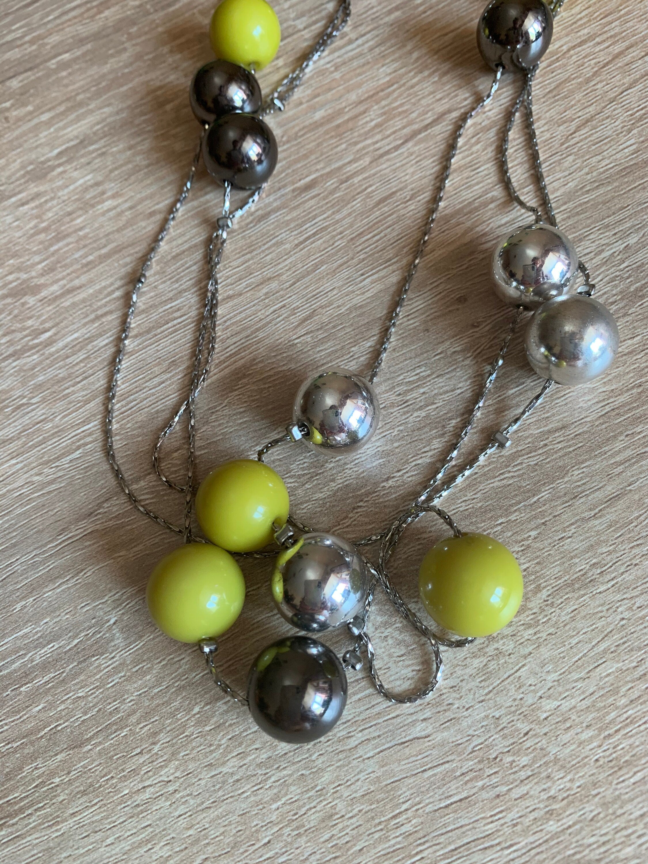 Stylish acid green and silver round beads on a very thin metal chain long continuous vintage necklace for a woman. Lovely gift for her