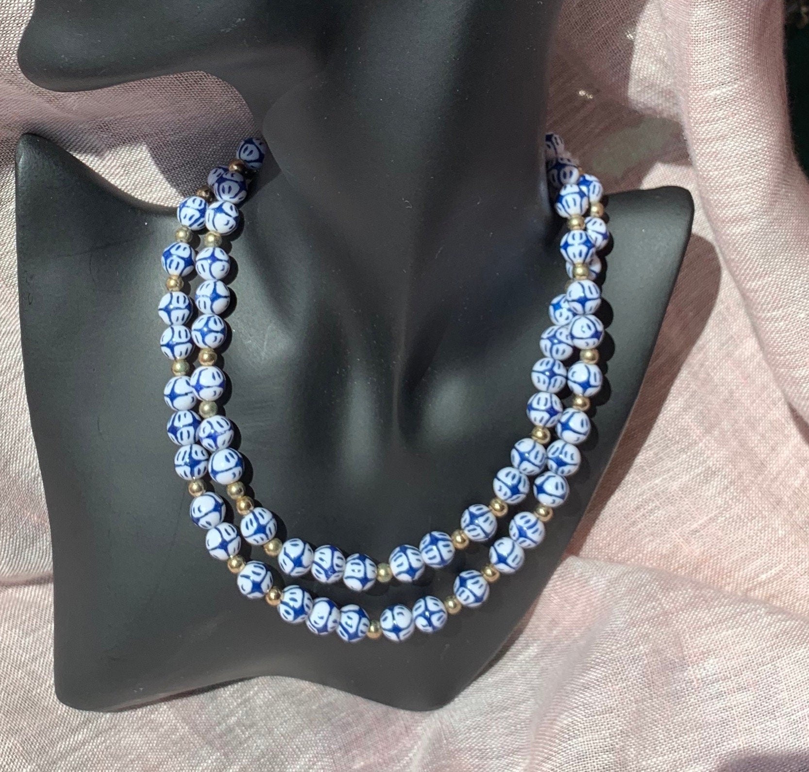 White and blue round plates beads interspaced with smaller metal beads long vintage necklace for a woman. Gift for her.