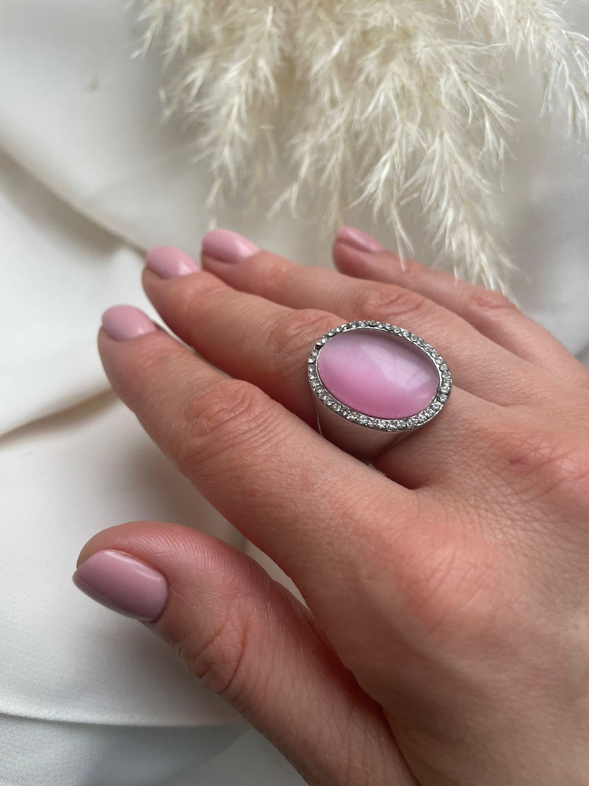 Pink Cat’s eye oval cabochon surrounded with diamantes and silver metal statement ring for a woman. Lovely vintage gift for her or unisex.