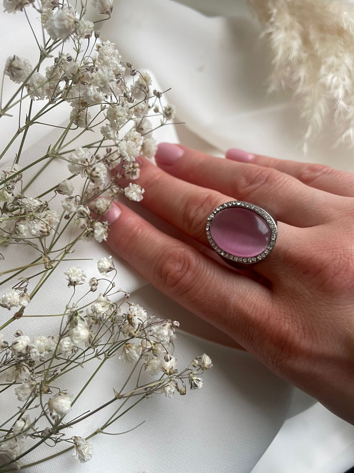 Pink Cat’s eye oval cabochon surrounded with diamantes and silver metal statement ring for a woman. Lovely vintage gift for her or unisex.