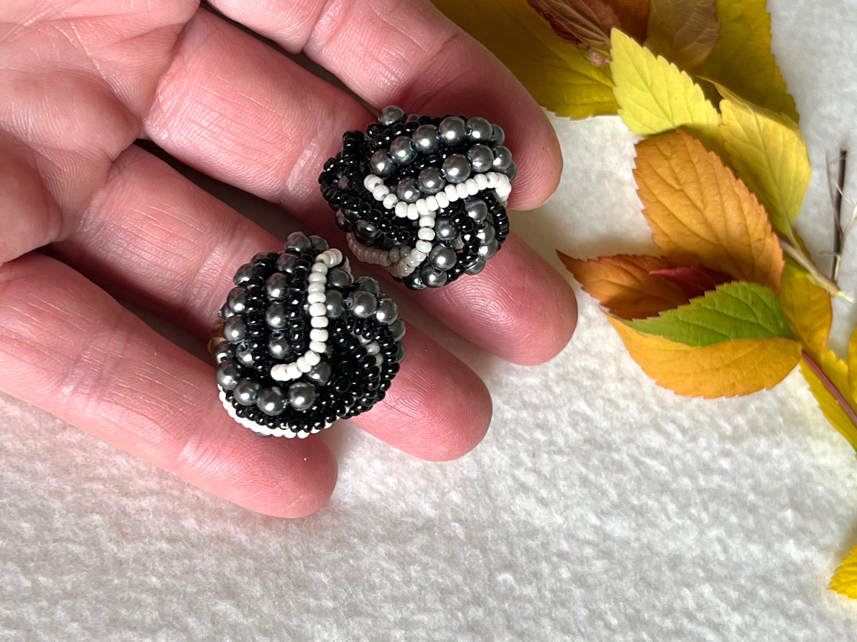 An interesting pair of black and white seed beads clip on vintage earrings for a woman. Elegant earrings for her. Lovely vintage gift.