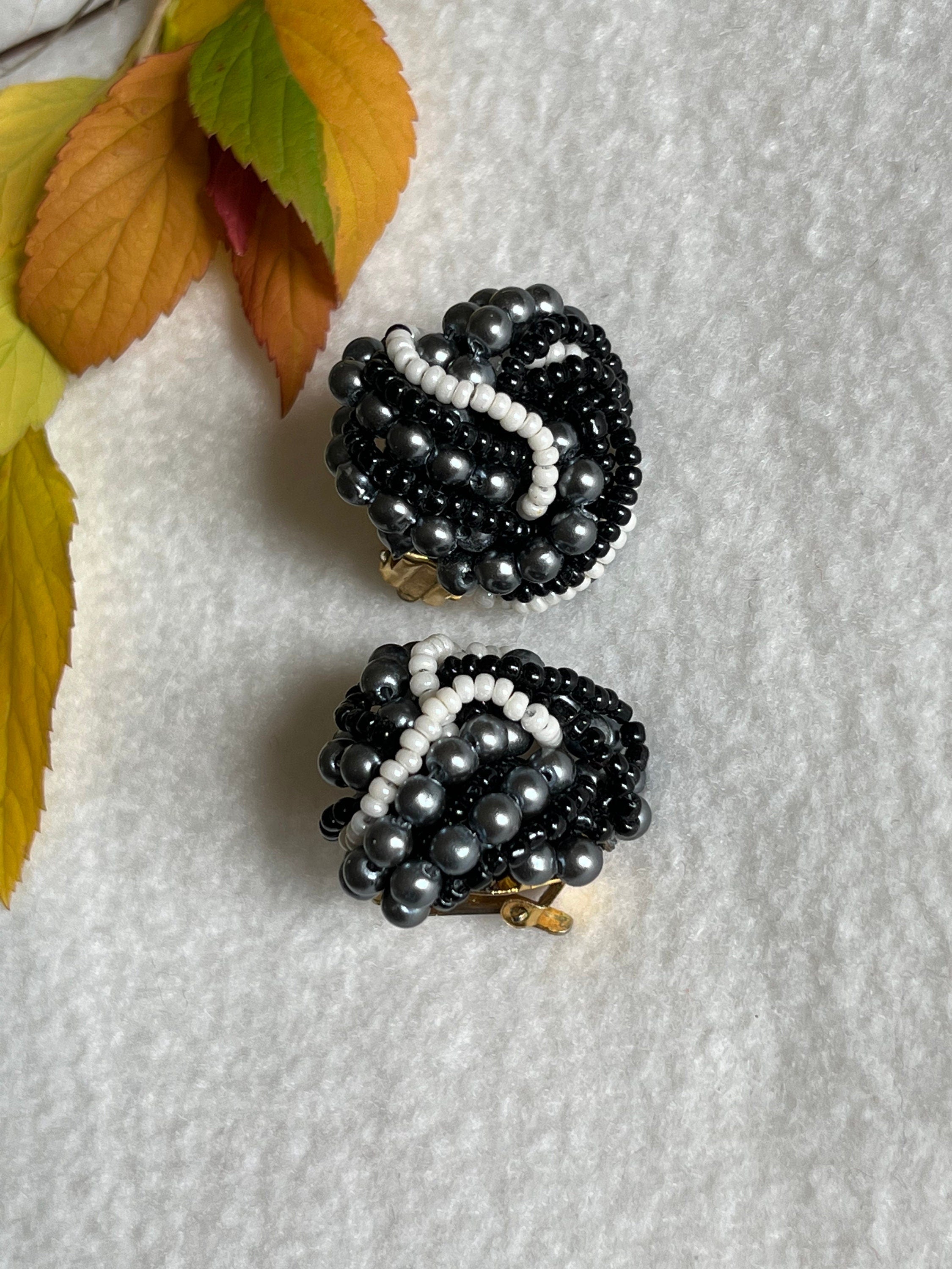 An interesting pair of black and white seed beads clip on vintage earrings for a woman. Elegant earrings for her. Lovely vintage gift.