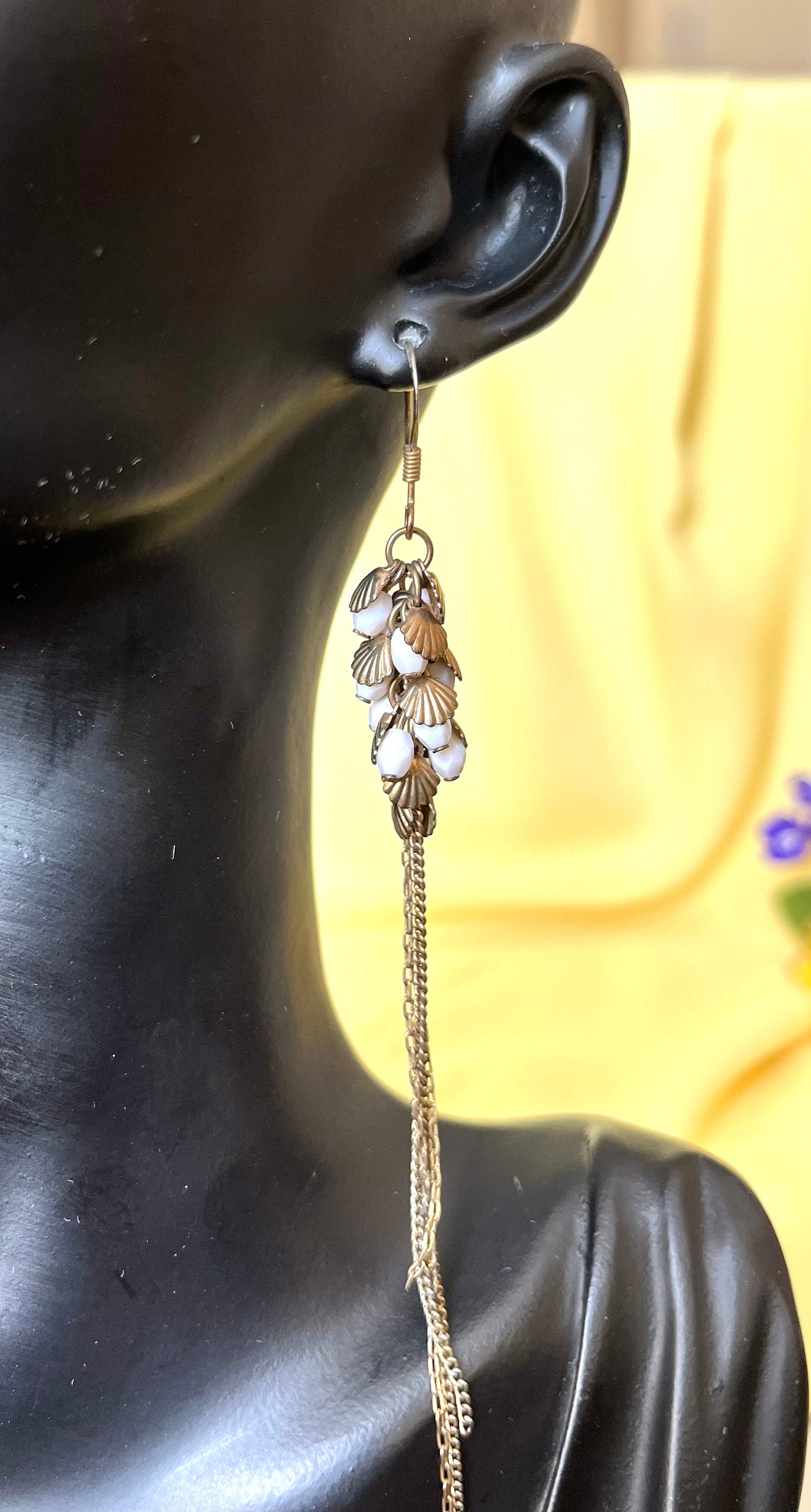 Very long brass and white plastic beads cluster with a tassel dangle drop earrings. Vintage earrings for a woman. Beautiful gift for her.