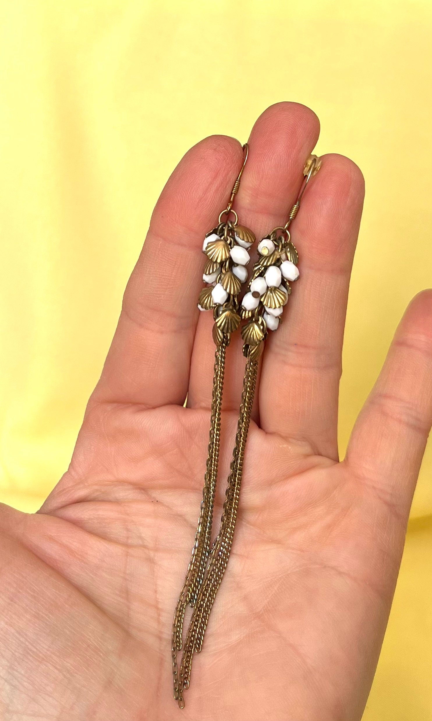 Very long brass and white plastic beads cluster with a tassel dangle drop earrings. Vintage earrings for a woman. Beautiful gift for her.