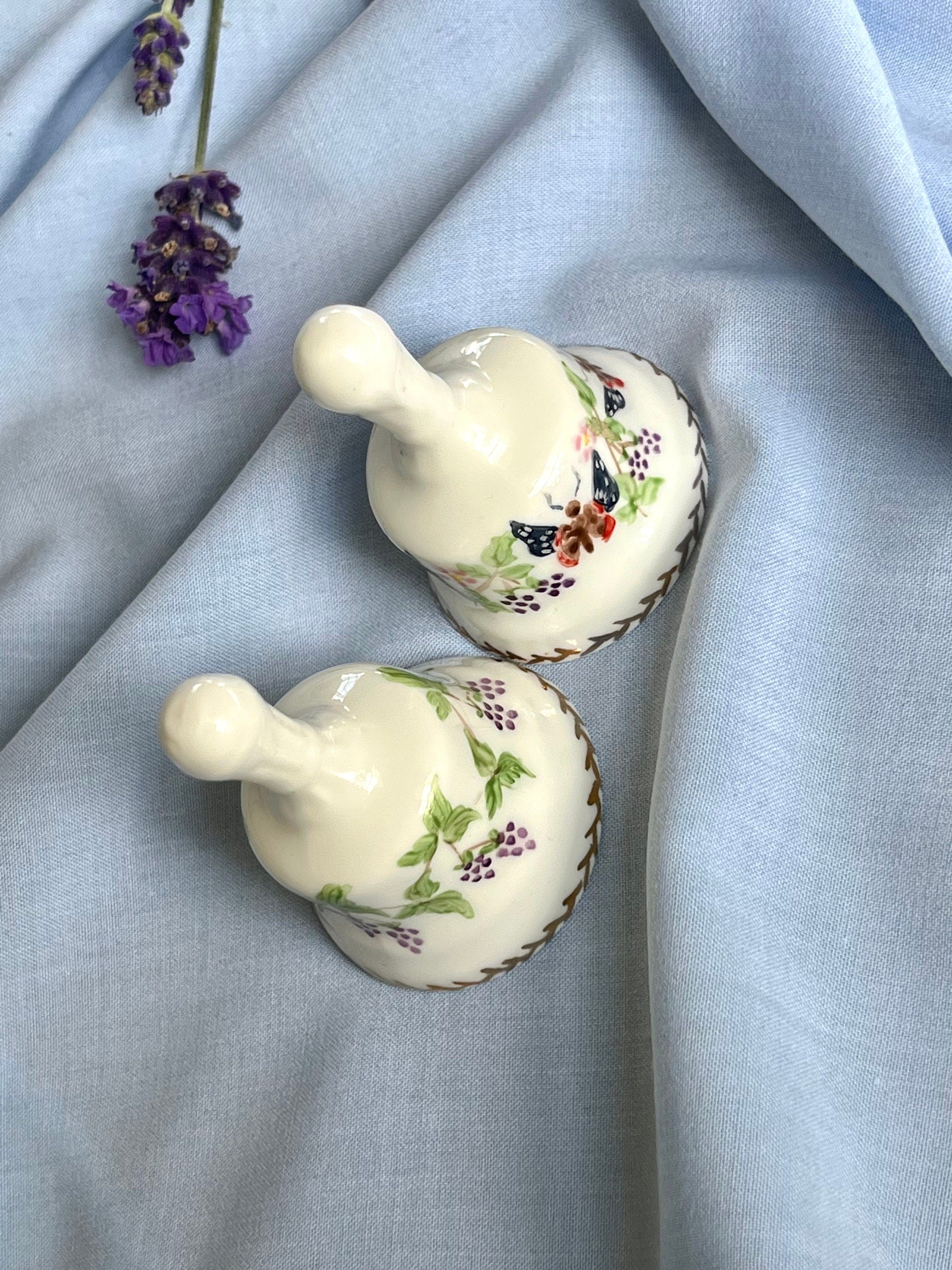 A pair of signed by artist Agneta Hickley vintage 90s white porcelain bells with butterflies and berries patterns. Collectible gift unisex