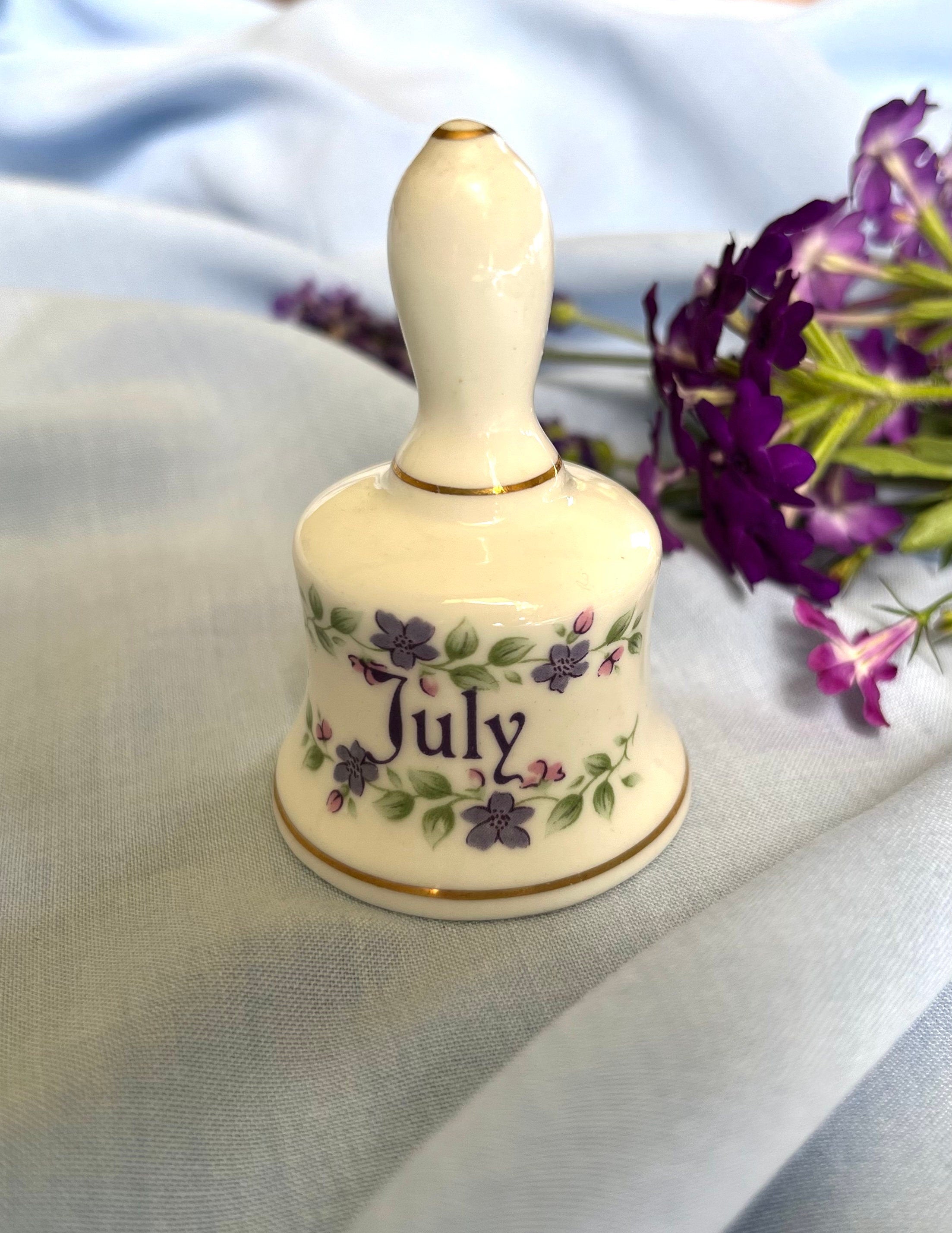 Signed July made in England bone china vintage bell with painted purple and pink flowers. Collectible souvenir from England. Gift unisex.