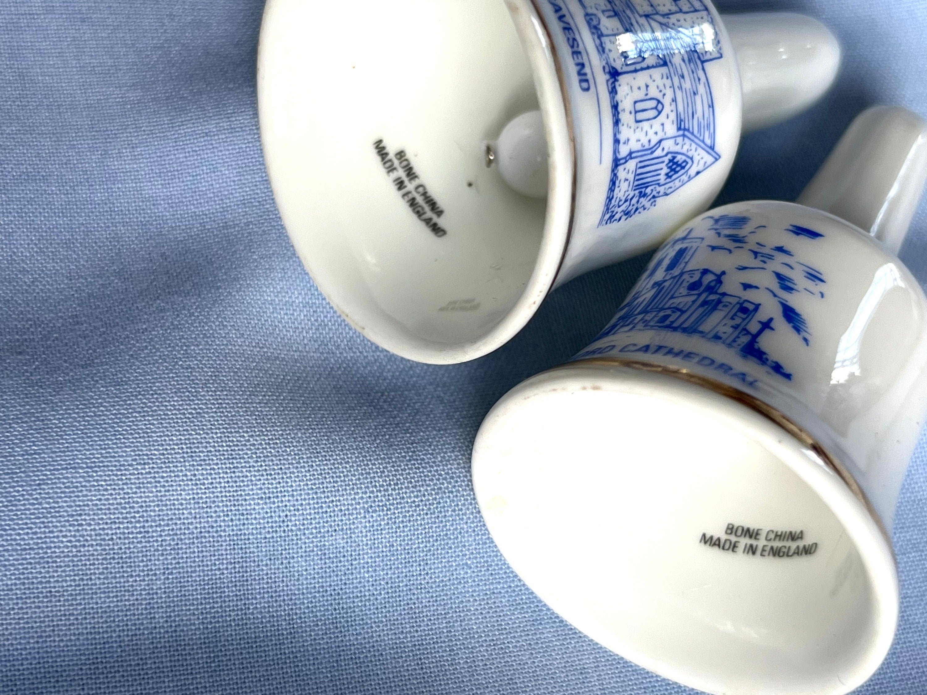 A pair of English heritage fine bone china bells with blue images and signs of Gravesend and Guildford cathedral. Collectible gift unisex.