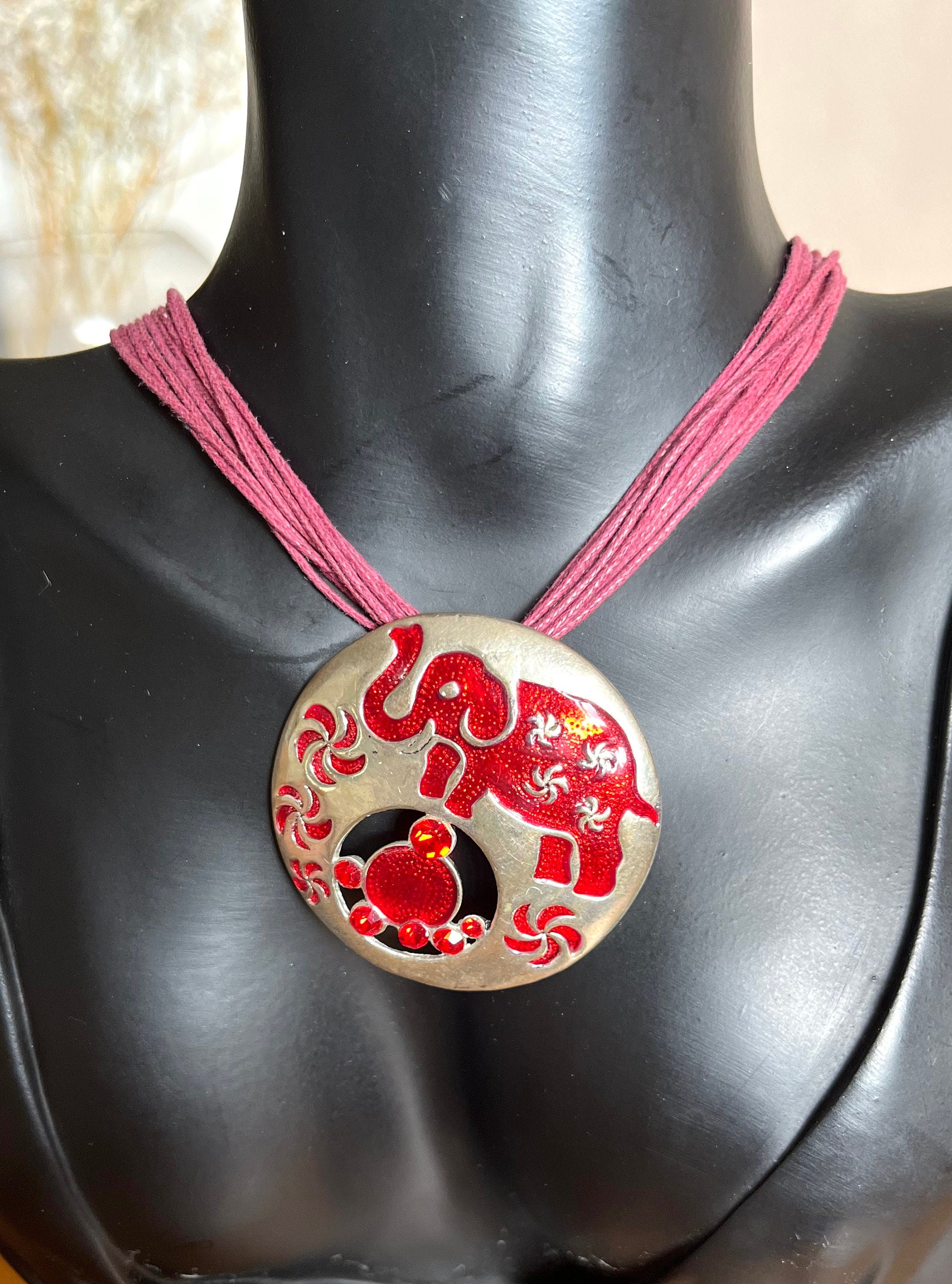 Red Elephant and money bag silver metal, enamel and red crystals amulet pendant on a multi strand cotton cord vintage choker necklace