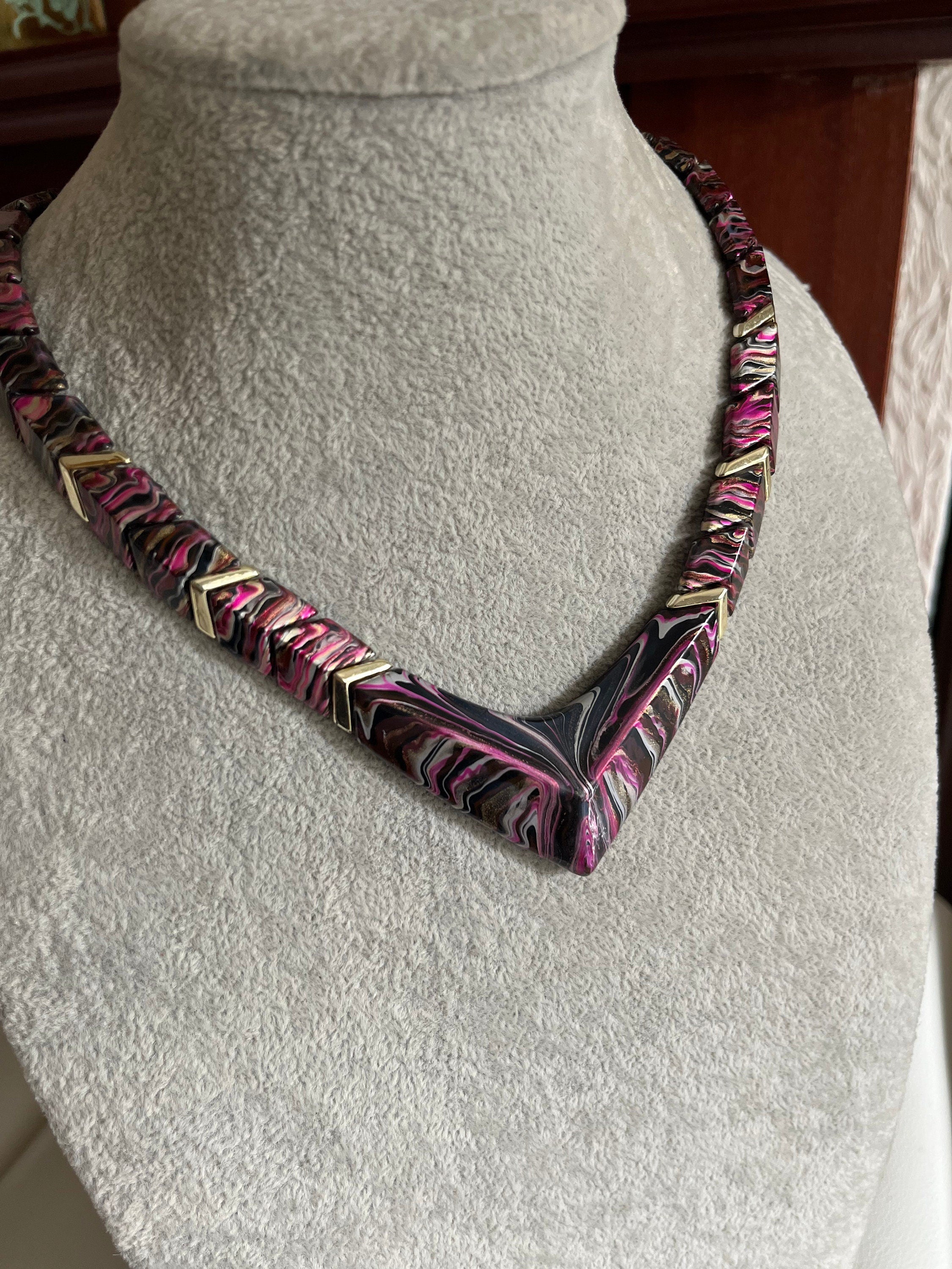 An interesting purple, black and white chevron shape vintage plastic choker necklace for a woman. Gift for her.