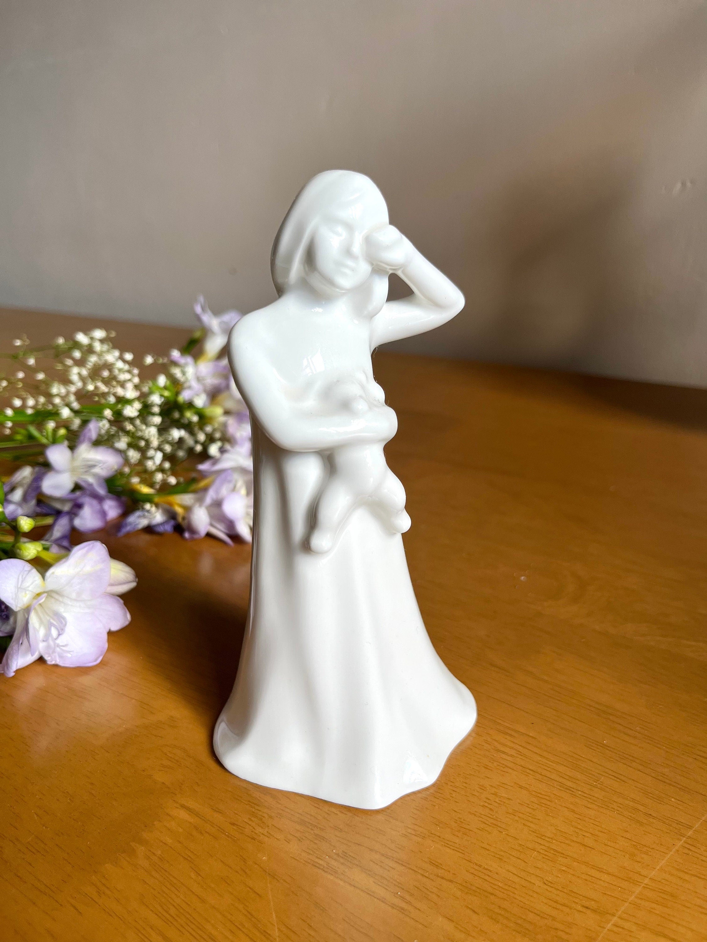 Signed Royal Doulton white bone china figurine of a sleepy girl holding a Teddy bear. Vintage collectible souvenir. Home decor. Gift unisex.