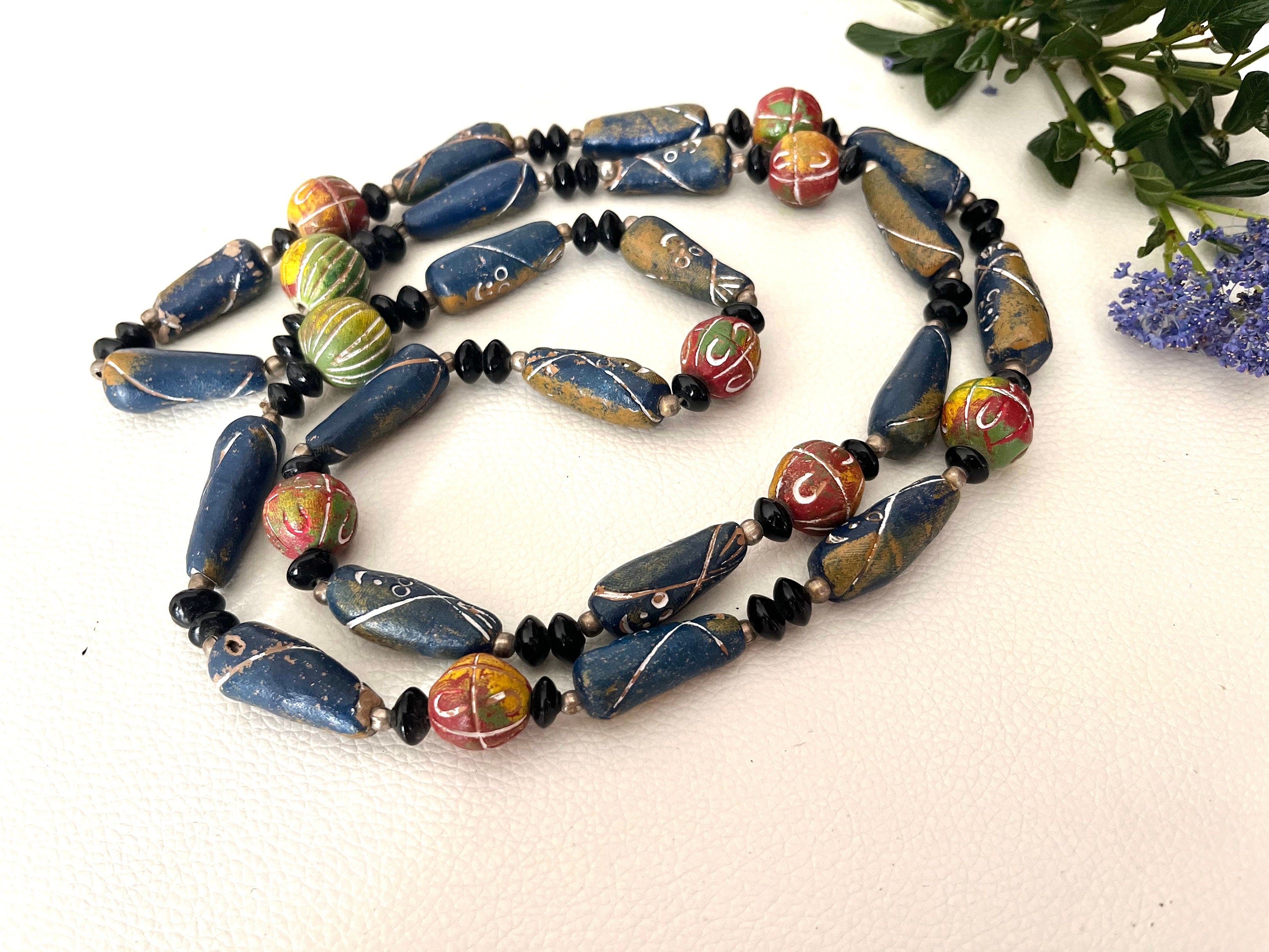 An interesting ceramic carved and multicolour painted long continuous vintage necklace. Boho style necklace. Gift for her. Gift unisex.