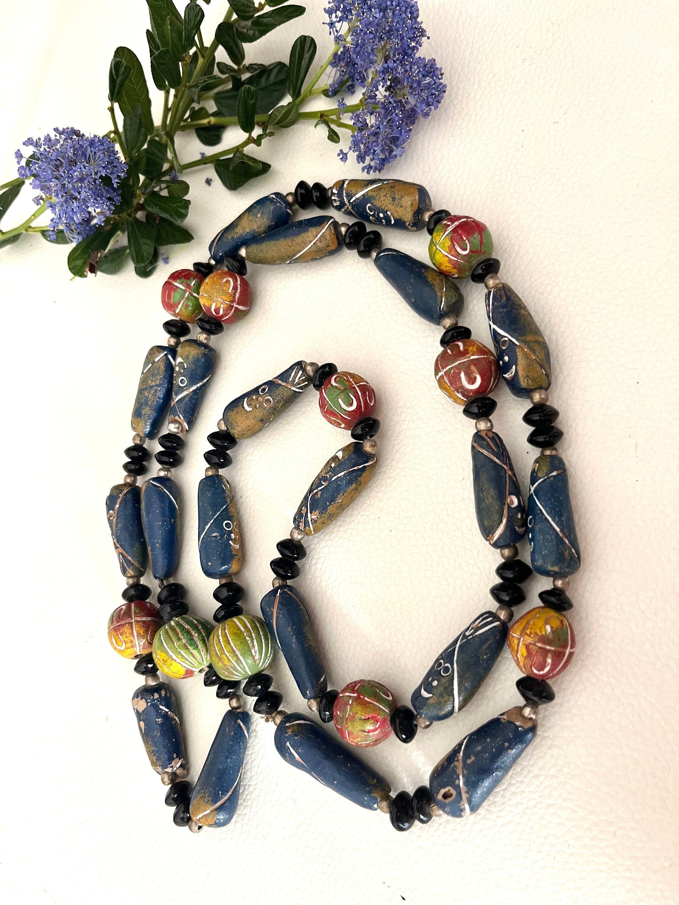 An interesting ceramic carved and multicolour painted long continuous vintage necklace. Boho style necklace. Gift for her. Gift unisex.