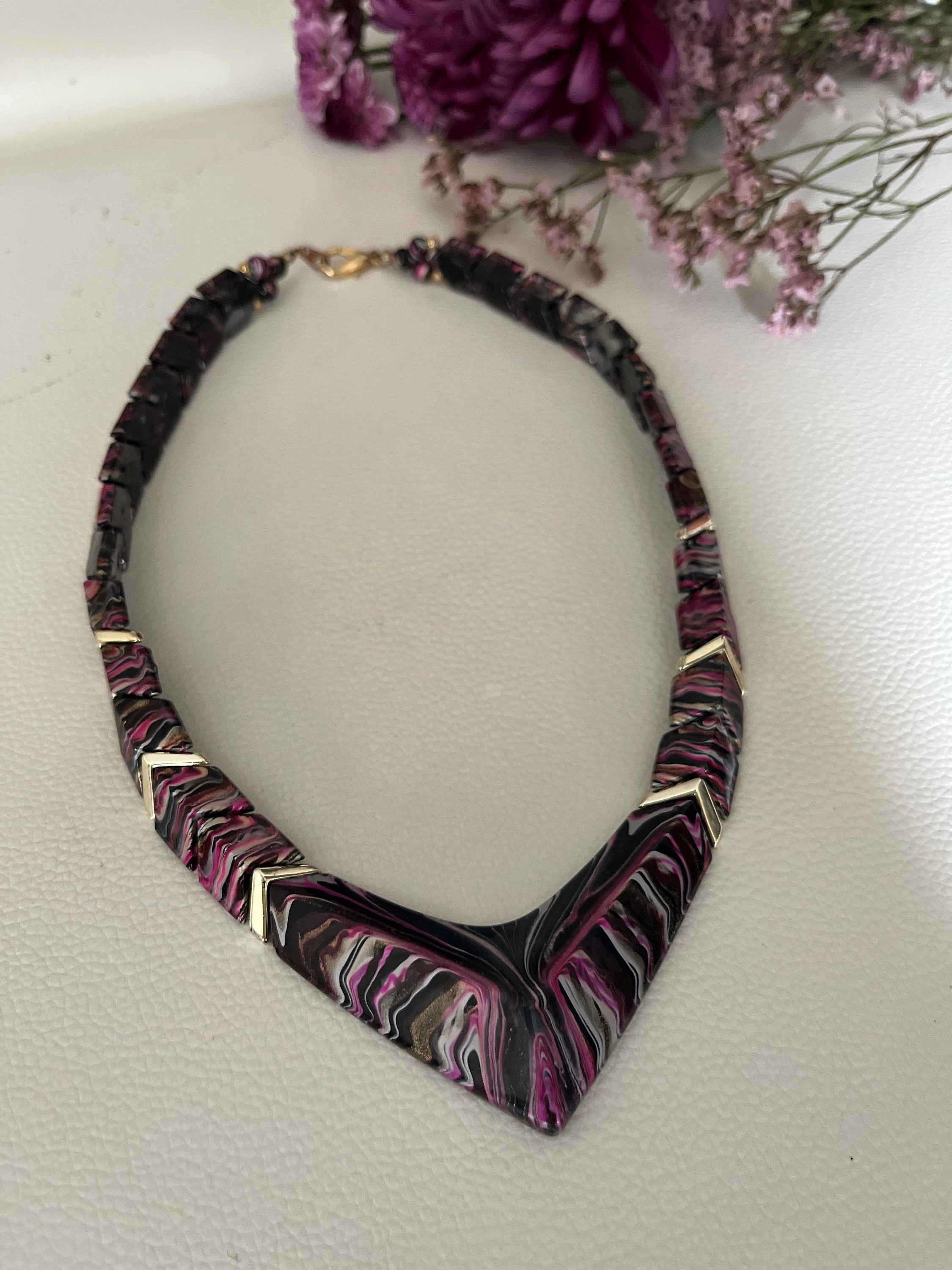 An interesting purple, black and white chevron shape vintage plastic choker necklace for a woman. Gift for her.