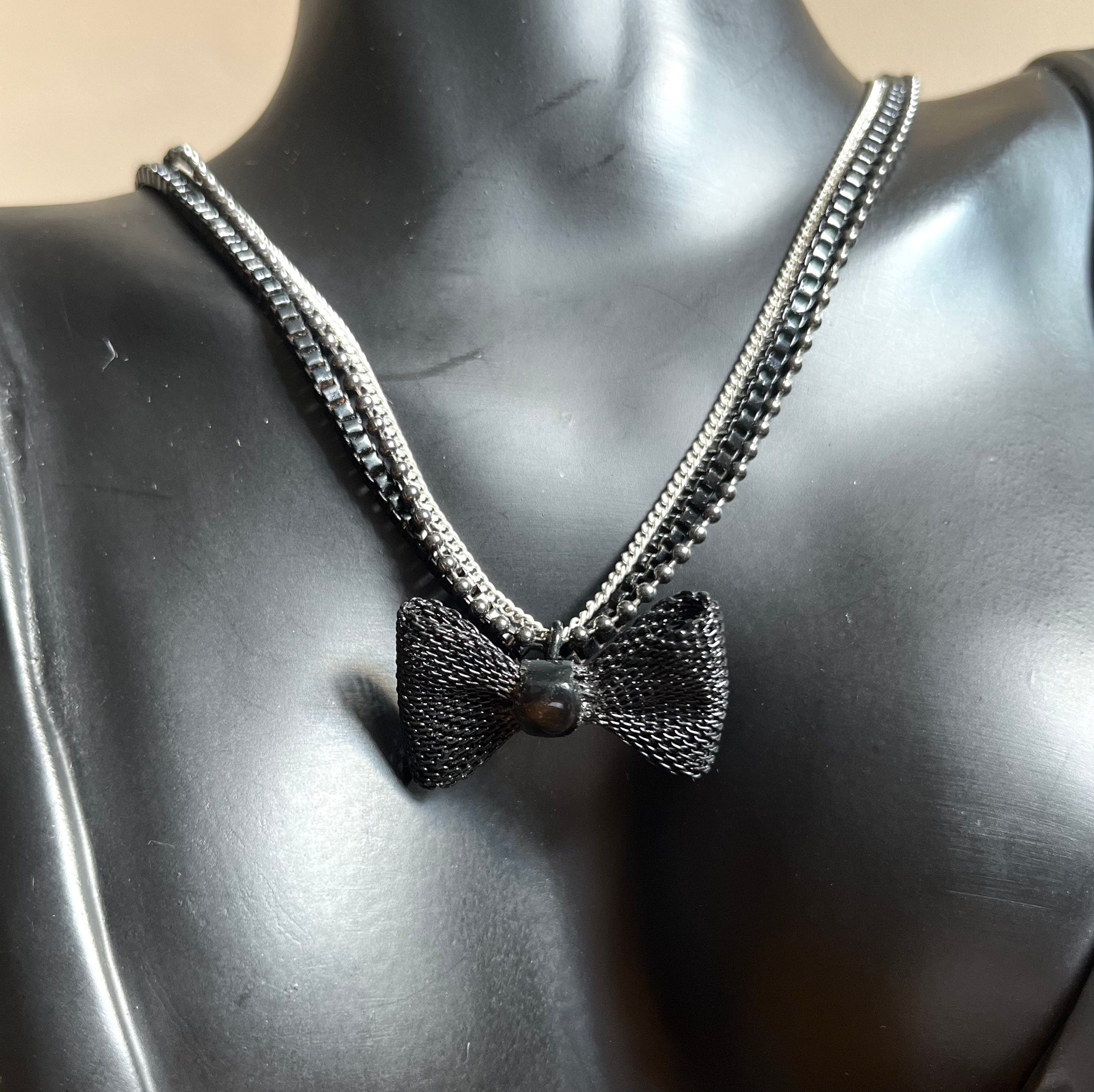 An interesting 3 strands silver and black metal chains vintage choker elasticated necklace with black metal mesh bow for women. Gift for her