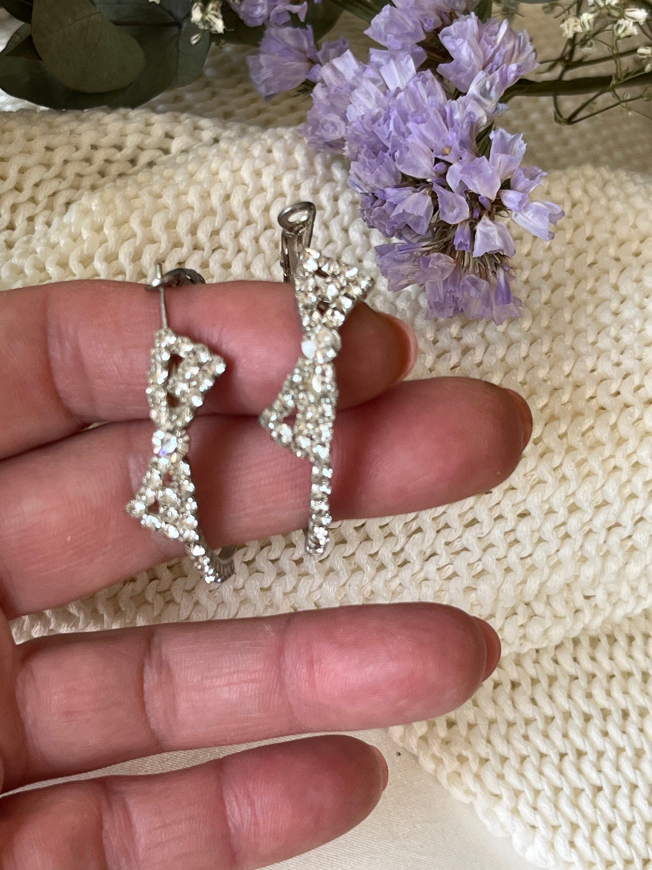 Silver tone metal and plenty of rhinestones sparkling large hoop with a bow vintage earrings. Earrings for a woman. Gift for her.