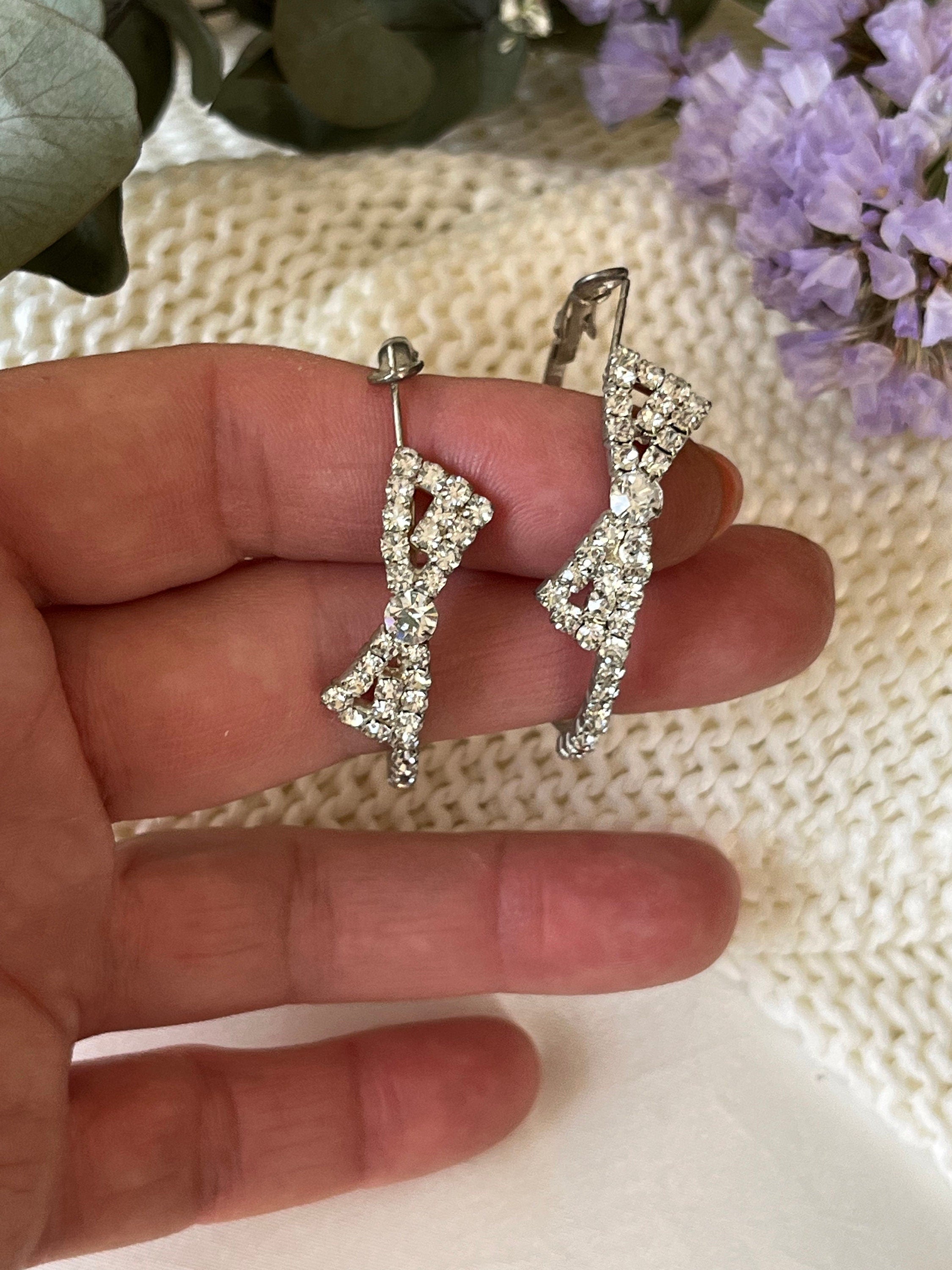 Silver tone metal and plenty of rhinestones sparkling large hoop with a bow vintage earrings. Earrings for a woman. Gift for her.